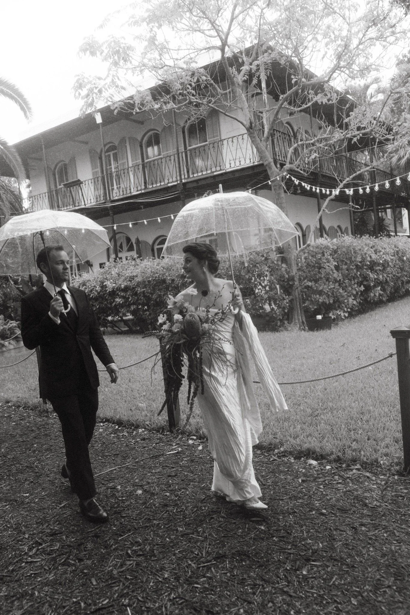 hemingway-home-key-west-wedding-couple-clear-umbrellas.jpg