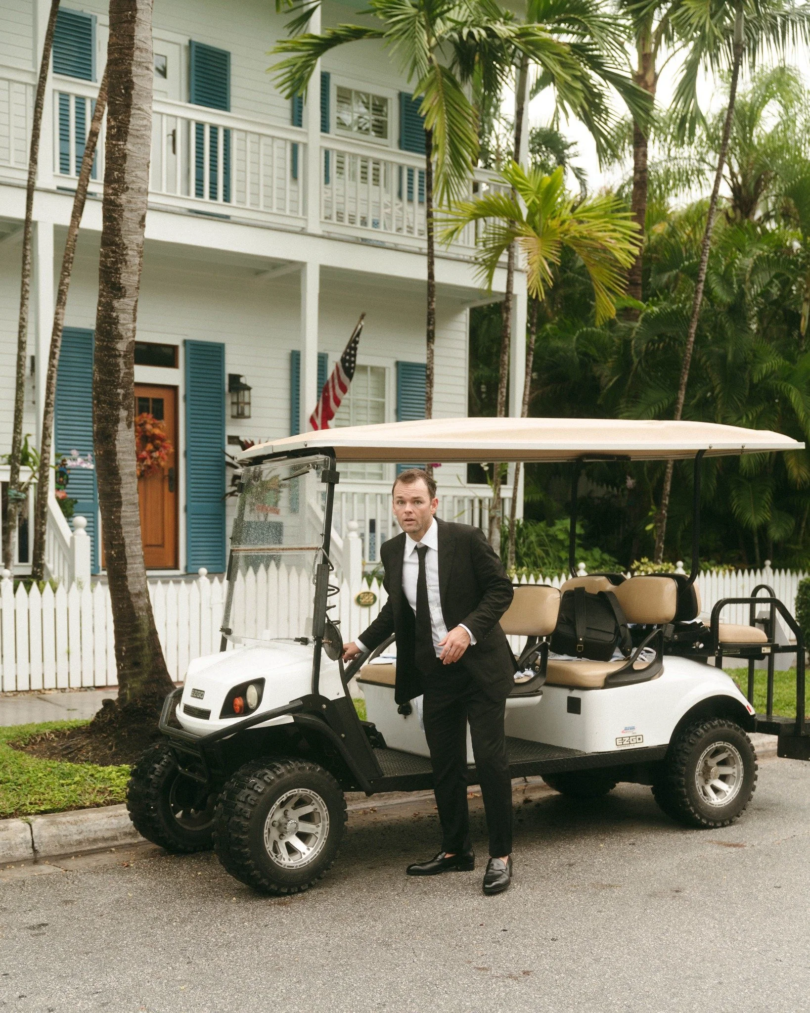 key-west-wedding-groom-golf-cart-tropical-street.jpg