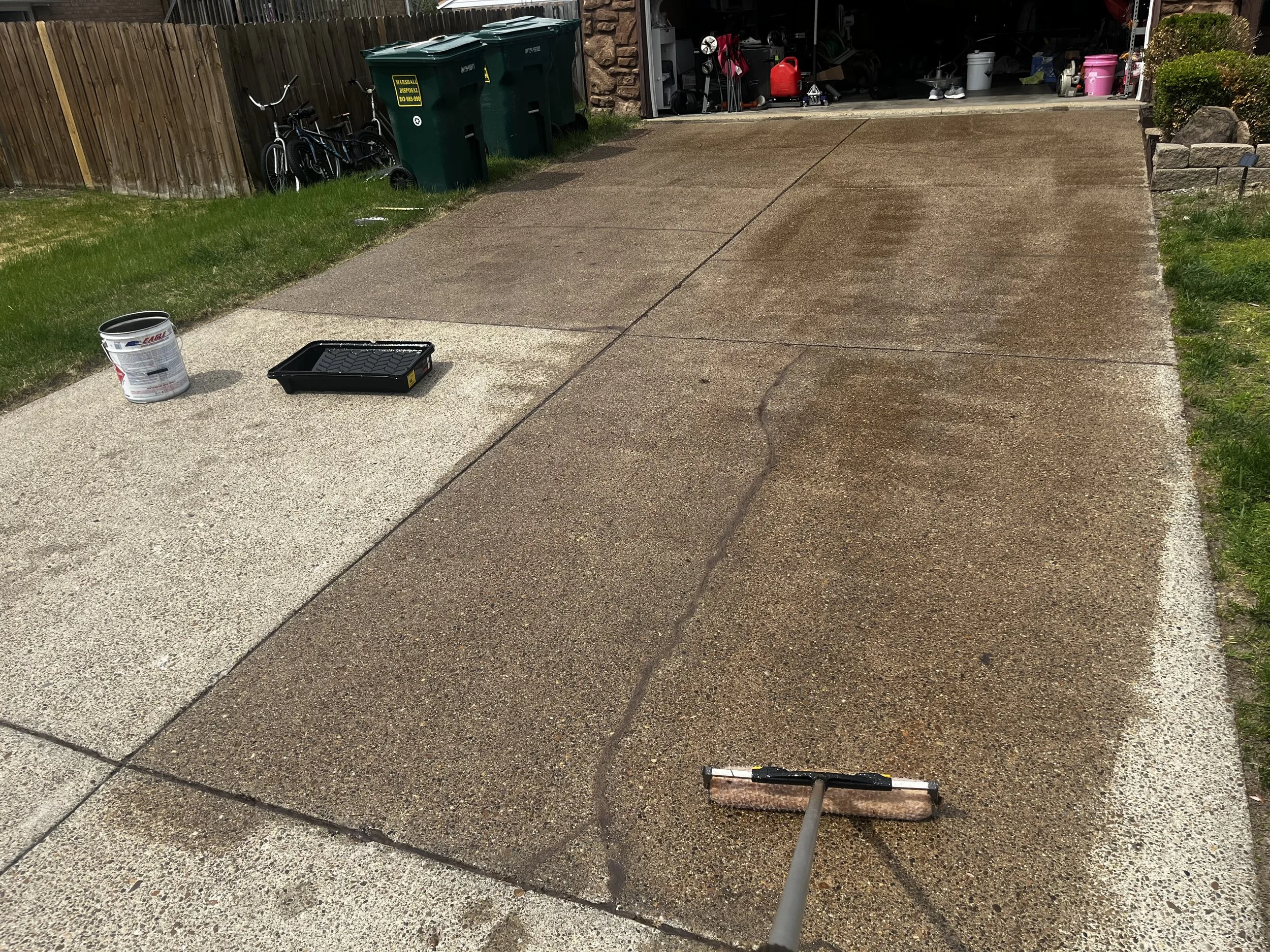 Work in progress showing a premium aggregate driveway sealing service by Meadors Services in Evansville, Indiana.