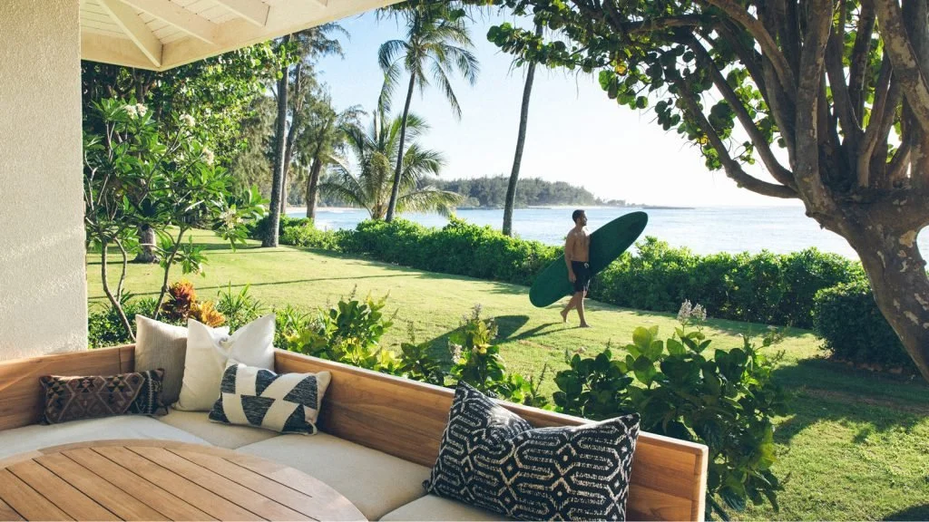 Turtle Bay Resort - Manuel with surfboard.jpg