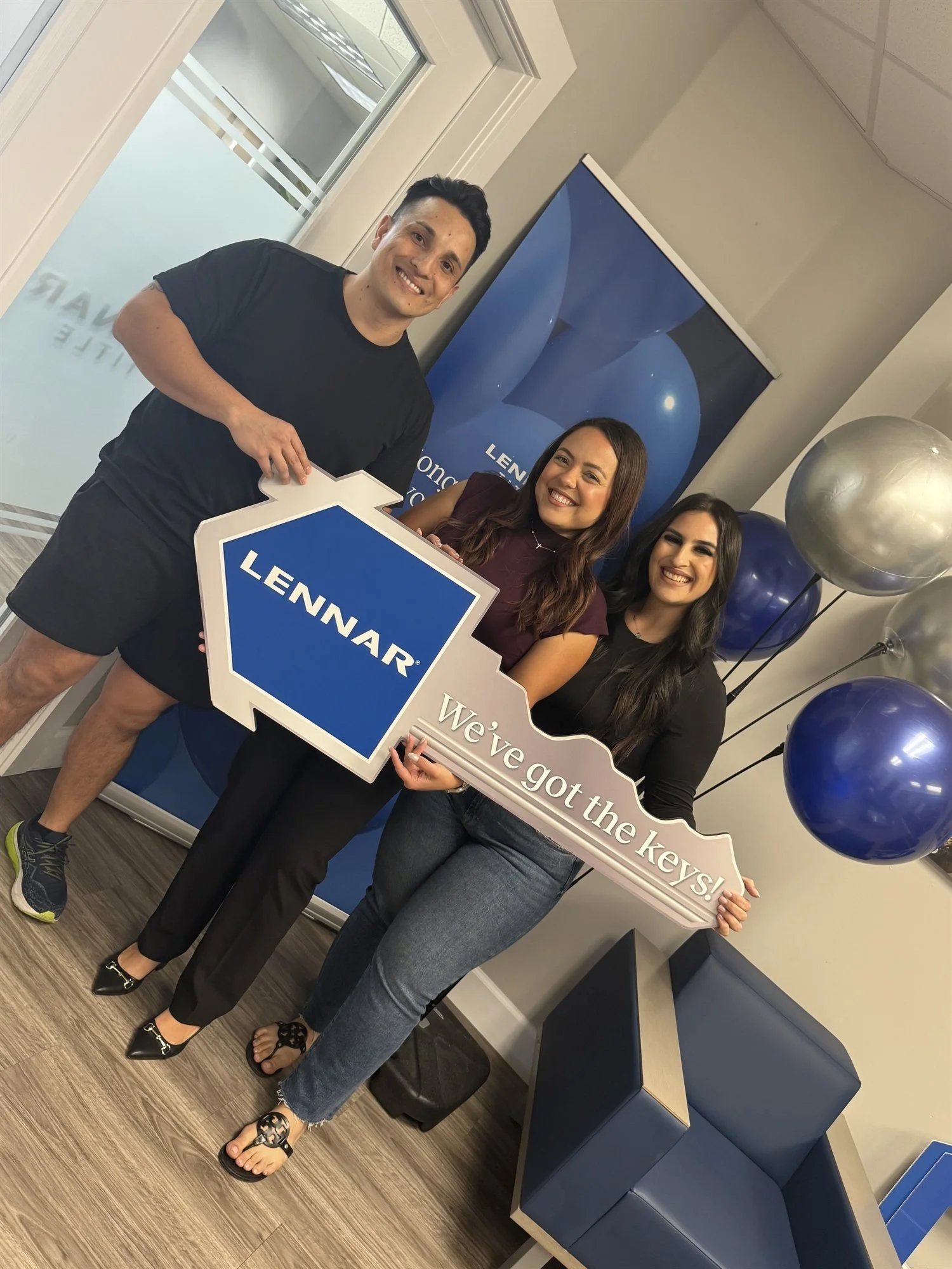 Andrea Cerrada celebrating a new construction closing with a Lennar key