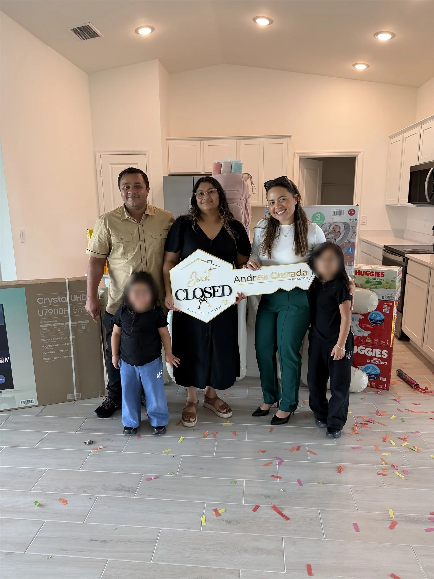 Andrea Cerrada, Naples REALTOR, celebrating with a family at their new home closing