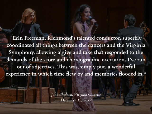 A woman singing into a microphone on stage, accompanied by a live orchestra with a pianist and conductor, during a performance.