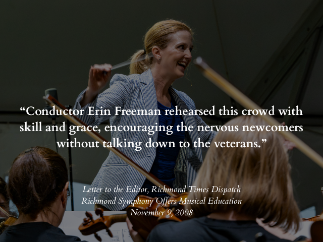Conductor Erin Freeman leading an orchestra, smiling, with musicians playing string instruments in the foreground.