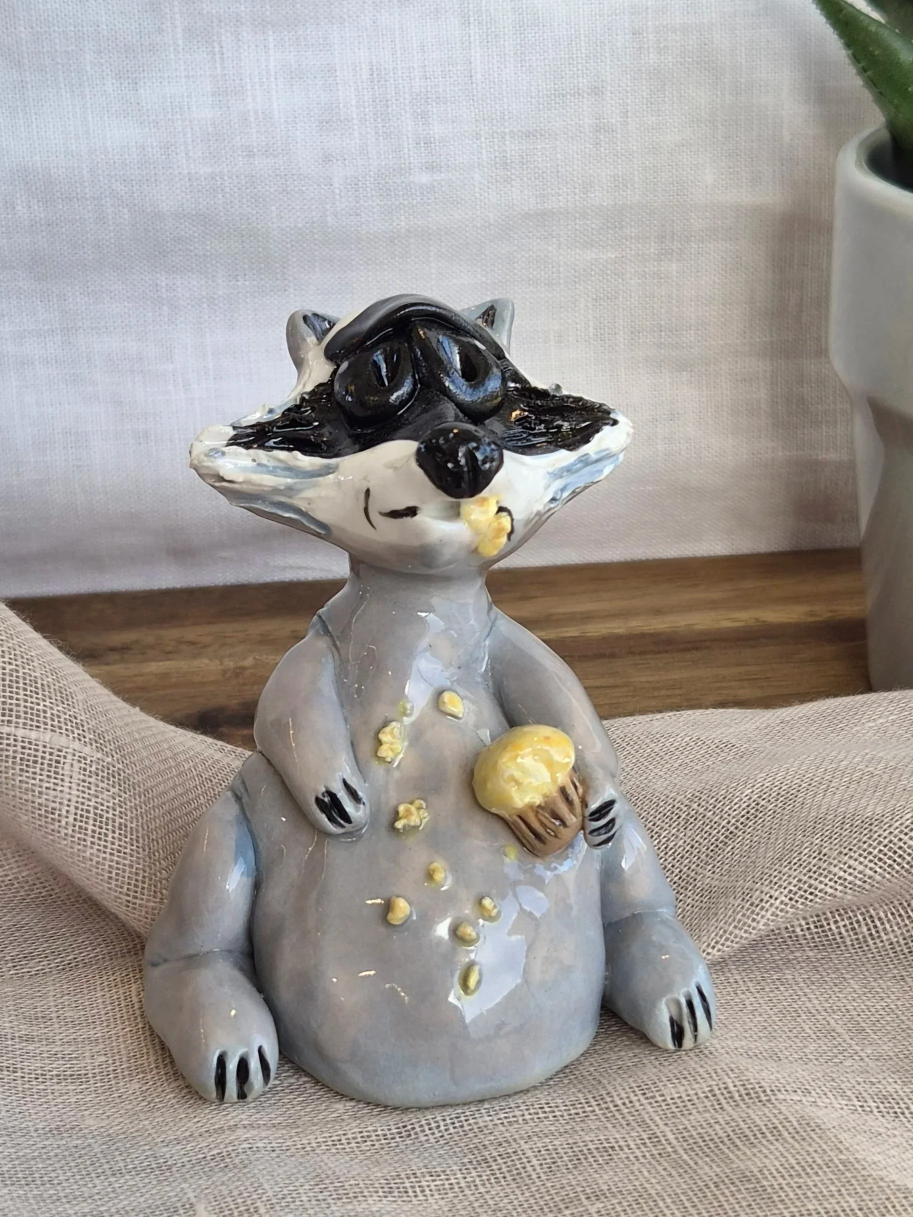 Raccoon with cupcake