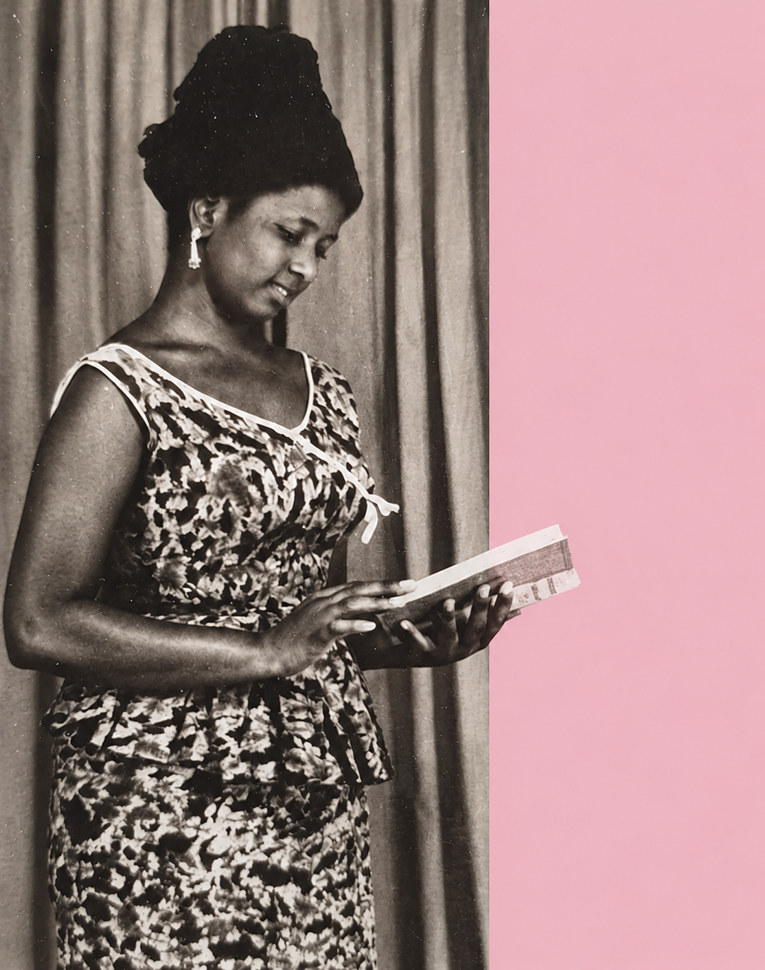 Black and white photo of a woman in traditional African attire, holding and reading a book, with a pink background on the right side of the image.
