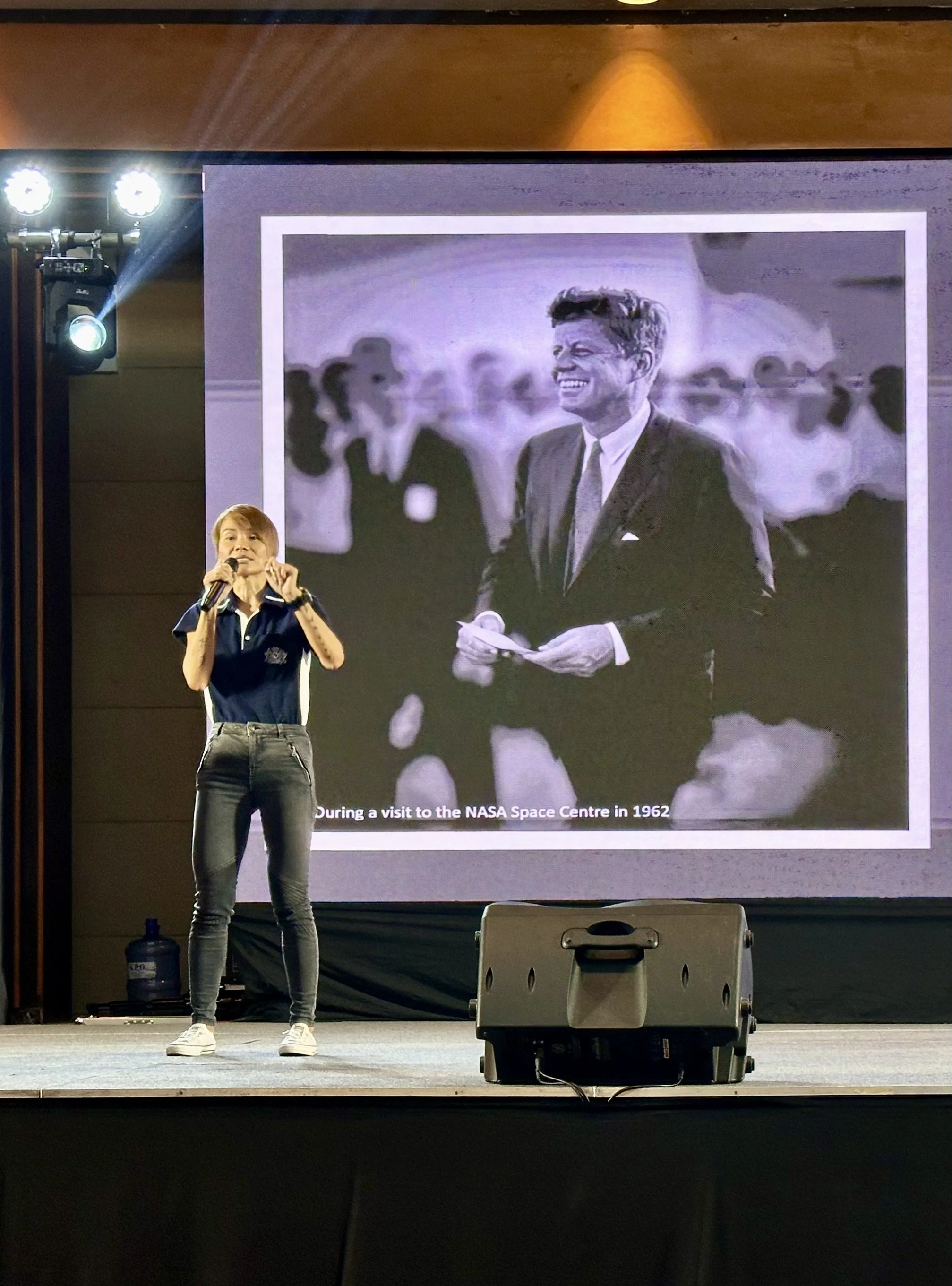 Odytide coach speaking on stage during a life design workshop