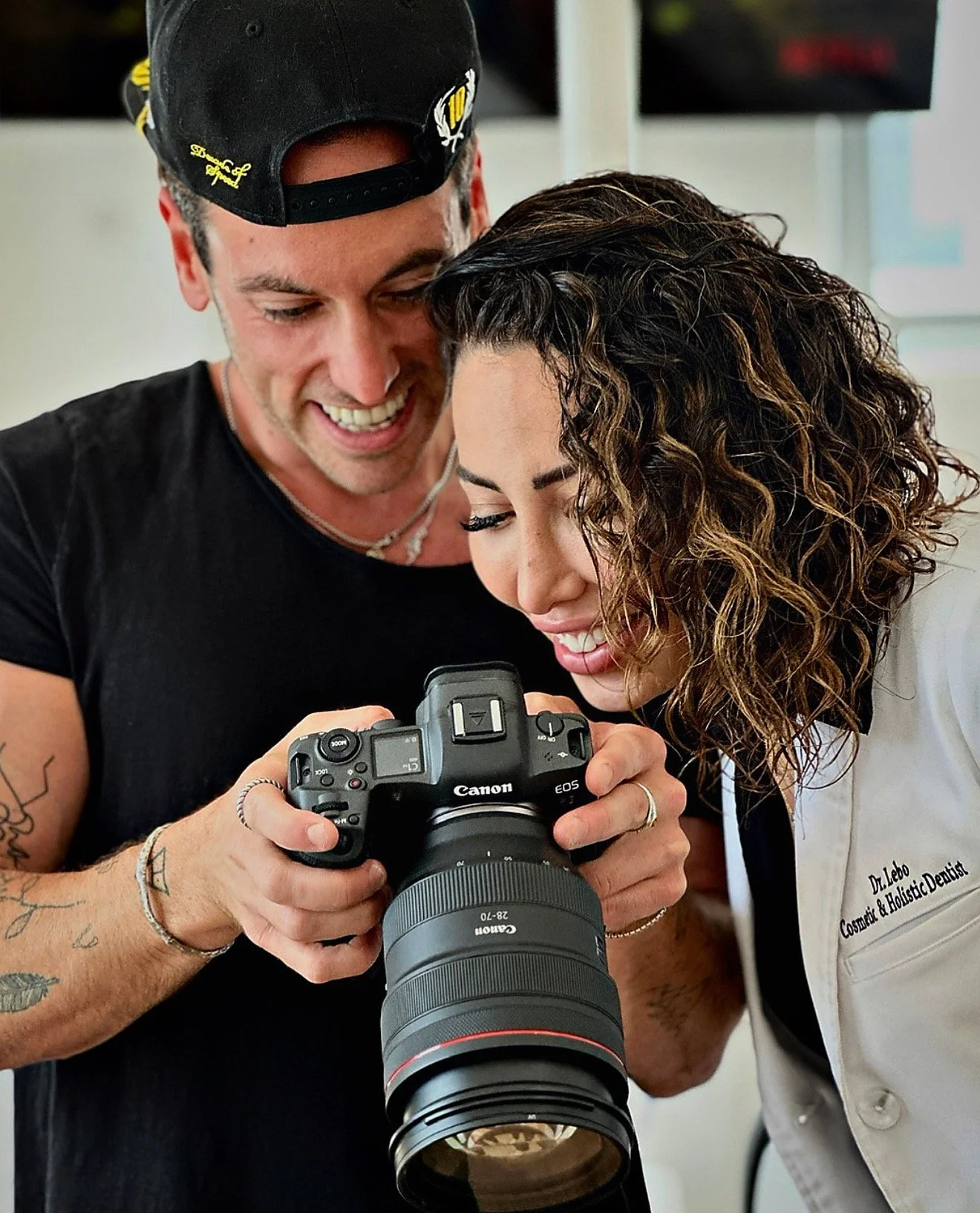 Dan Grab reviewing a shot on camera with a dentist