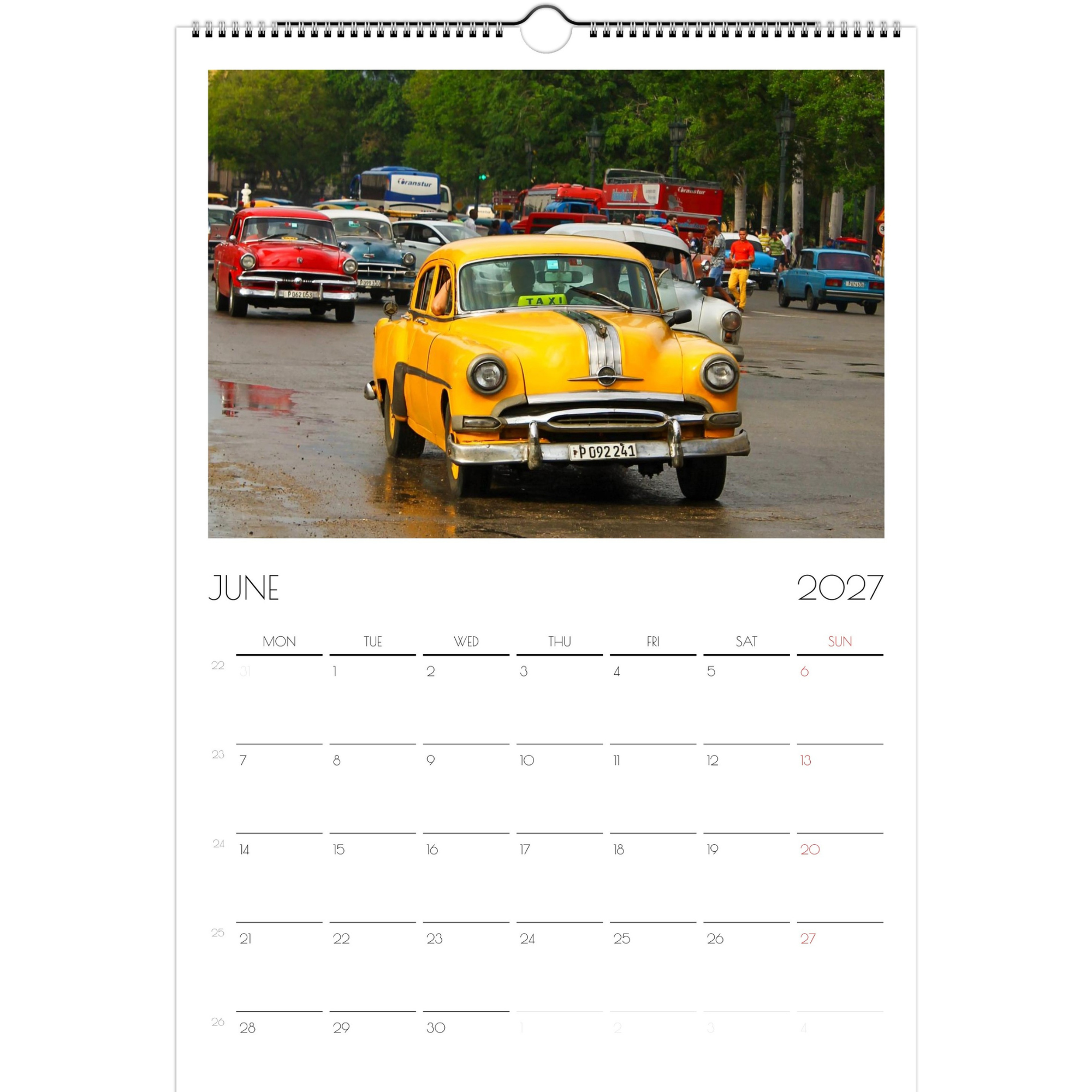 June page of the Classic Cars of Cuba 2027 calendar. The page features a bright yellow classic car driving down a rainy Havana, Cuba street. Other classic cars follow.