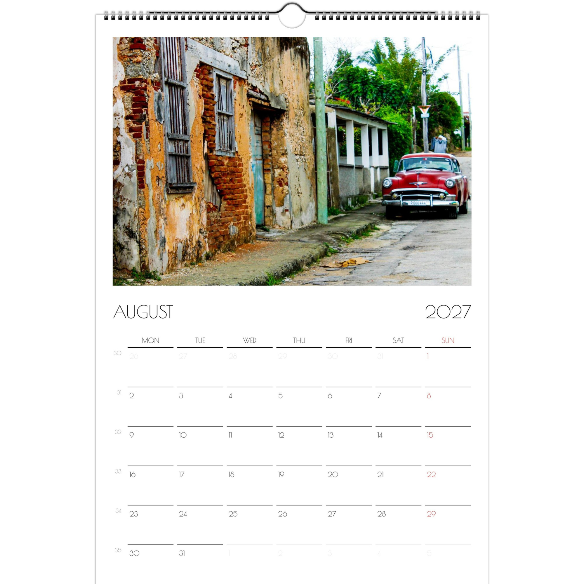 August page of the Classic Cars of Cuba 2027 calendar. The page features a ruby-colored classic Chevy parked on a run-down Cuban street.