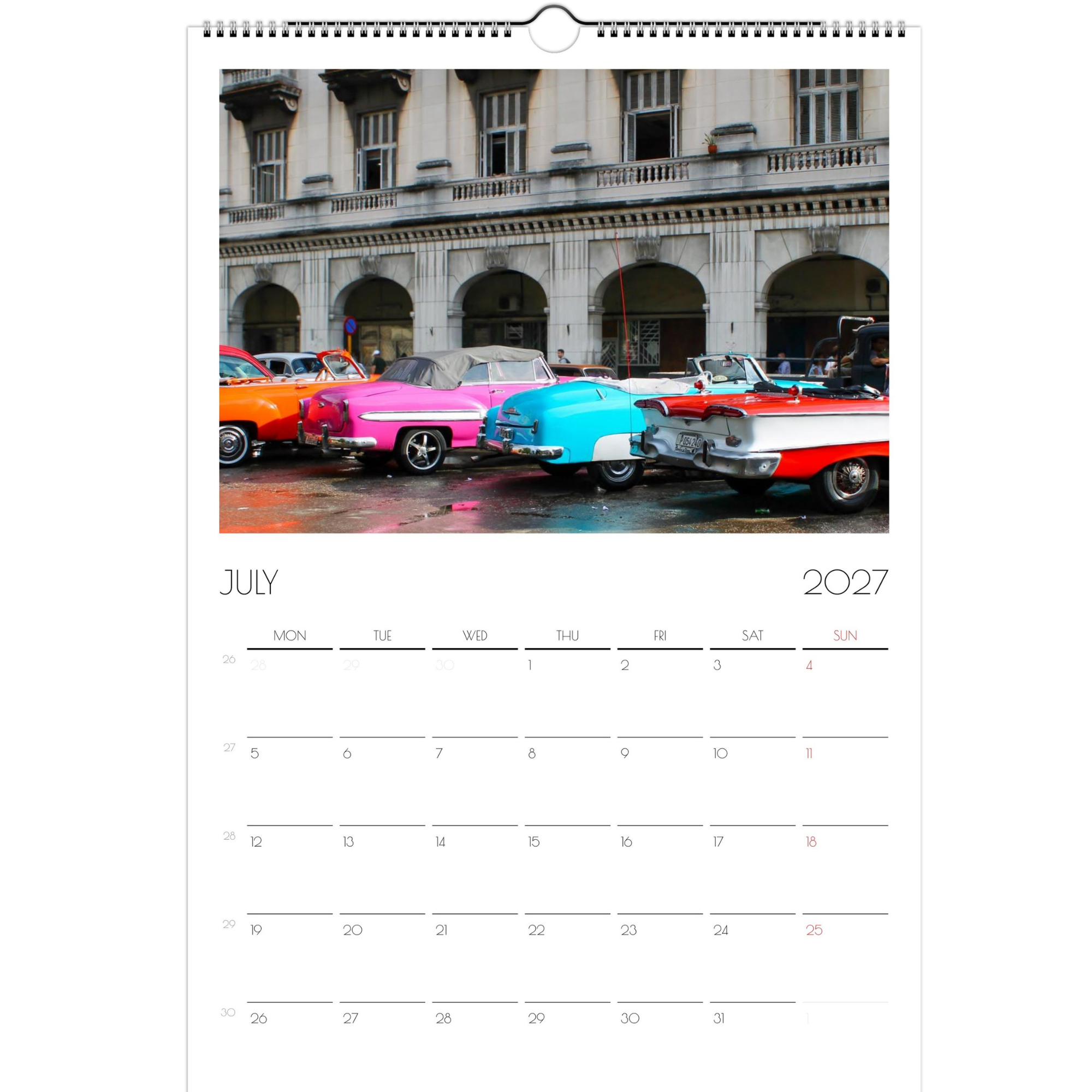 July page of the Classic Cars of Cuba 2027 calendar. The page features a row of parked classic cars in Havana, Cuba. The cars are brightly painted and stand out against the bland building in back.