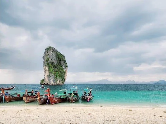 Longtail boats on the beach at Poda Island in Krabi