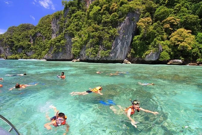 phi-phi-guests-snorkeling-in-clear-turquoise-water.jpg