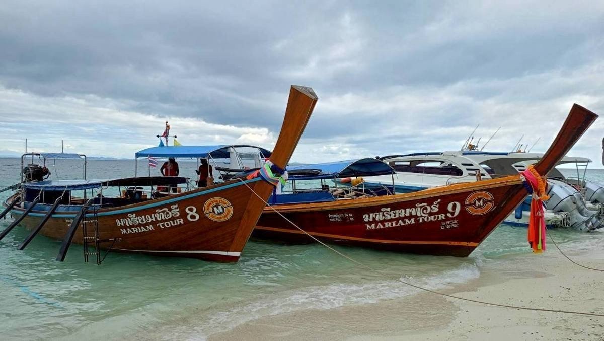 krabi-two-longtail-boats-and-speedboat-on-white-sand-beach.jpg