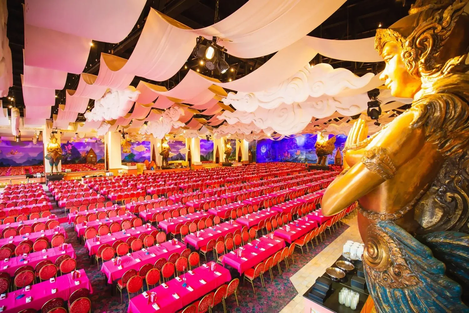 Golden Kinnaree buffet restaurant hall with pink tables at Phuket FantaSea