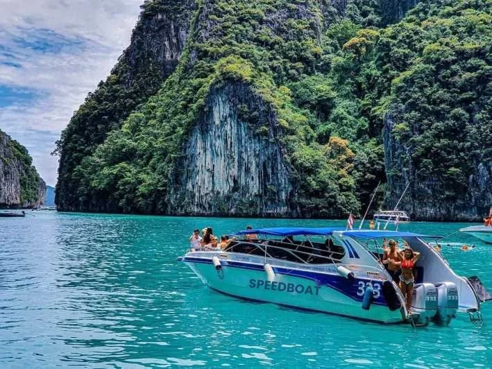 phi-phi-speedboat-in-turquoise-lagoon-between-limestone-cliffs.jpg