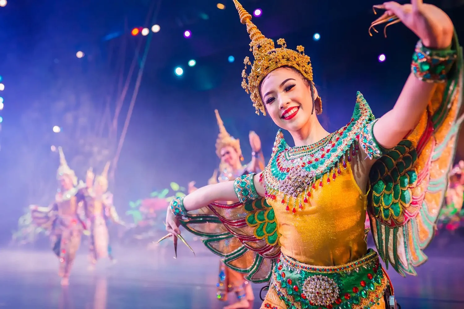 Thai dancer in a golden costume at the Phuket FantaSea show