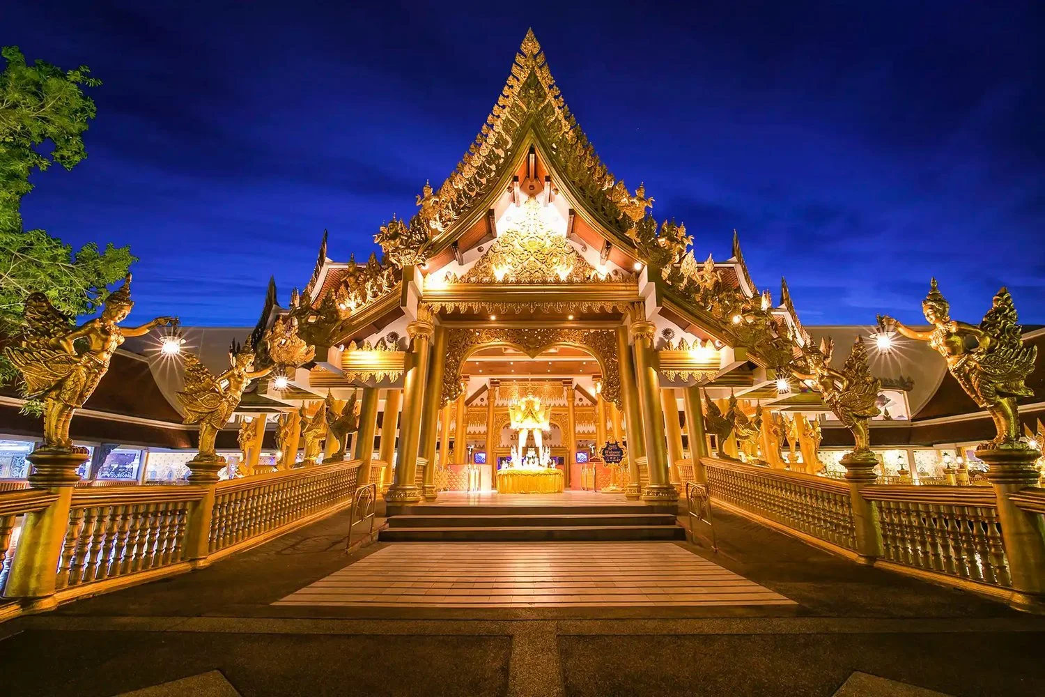 Golden Thai-style entrance to the Golden Kinnaree buffet restaurant at Phuket FantaSea at night