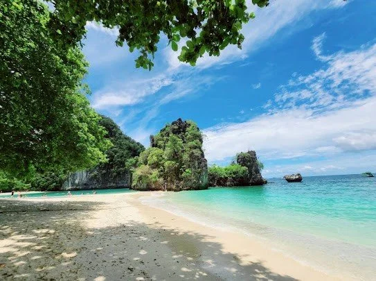 hong-island-white-sand-beach-shaded-by-trees.jpg