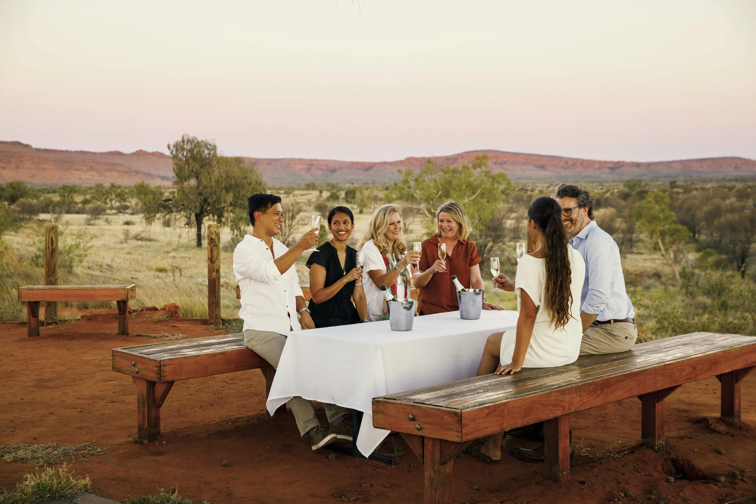A group of people enjoying drinks at Kings Canyon, NT, Australia.