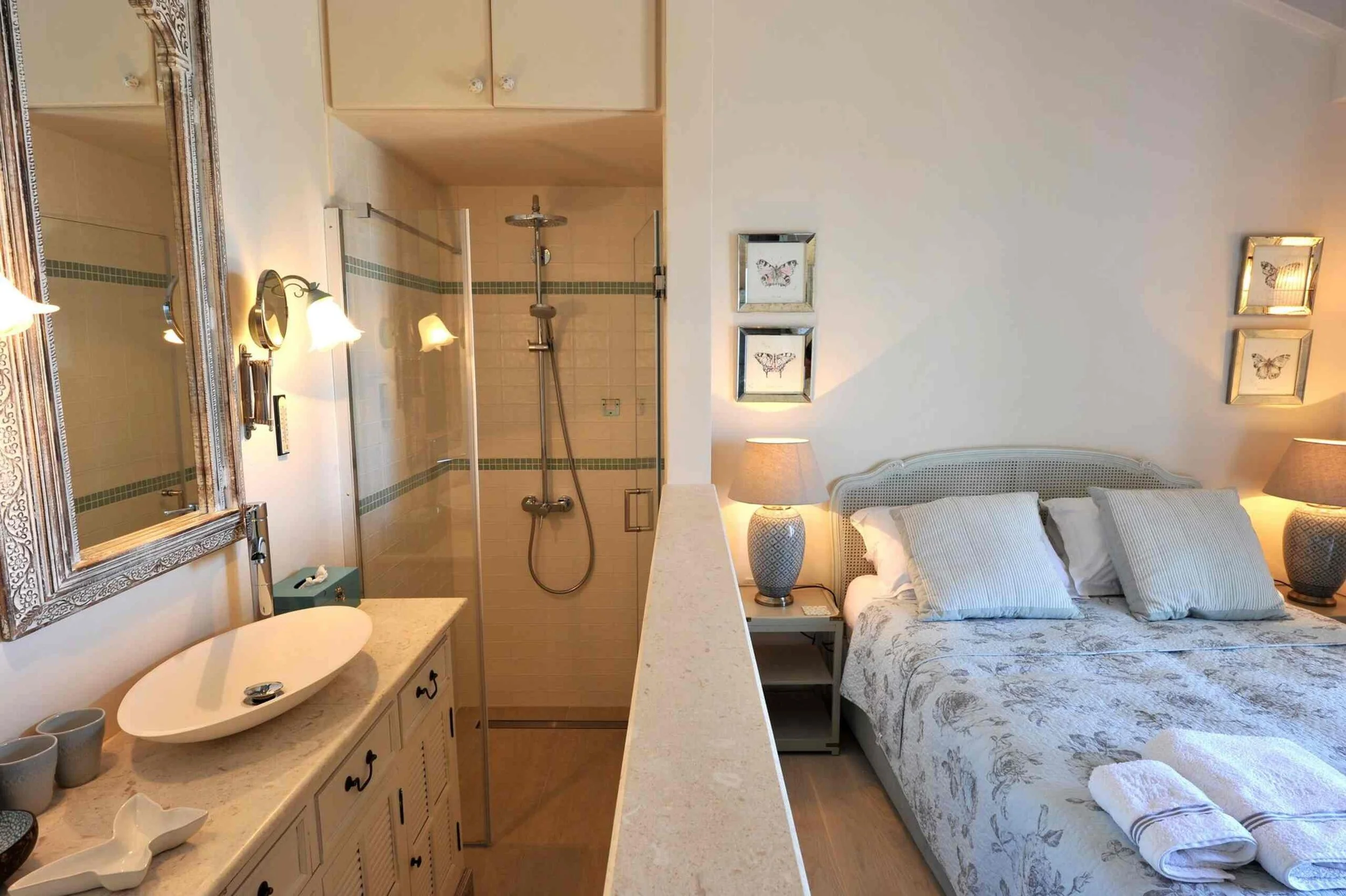 Middle double bedroom with king size bed (zip and Link) with shower and basin, AC, fan and safe.  WC across the hall. 