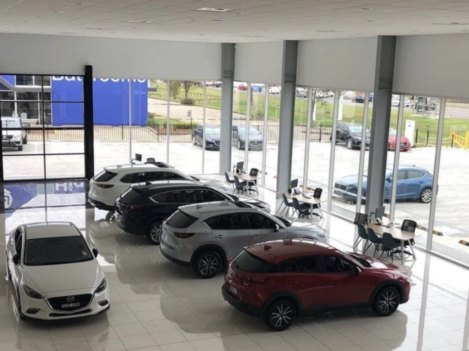 Professional showroom Window cleaning. Campbelltown Car dealerships. Showroom finish.