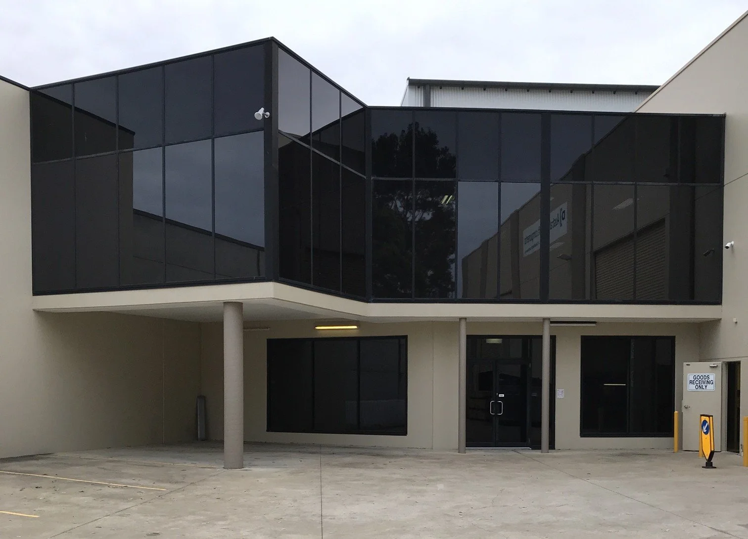 Double story commercial building. Window cleaning of offices inside and out Ingleburn Minto industrial area.