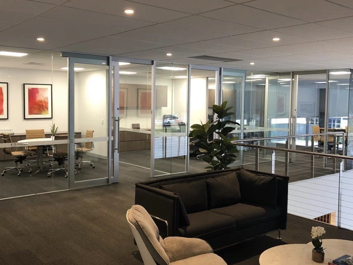 Modern offices with glass partition walls. Floor to ceiling glass.  Show rooms and offices.