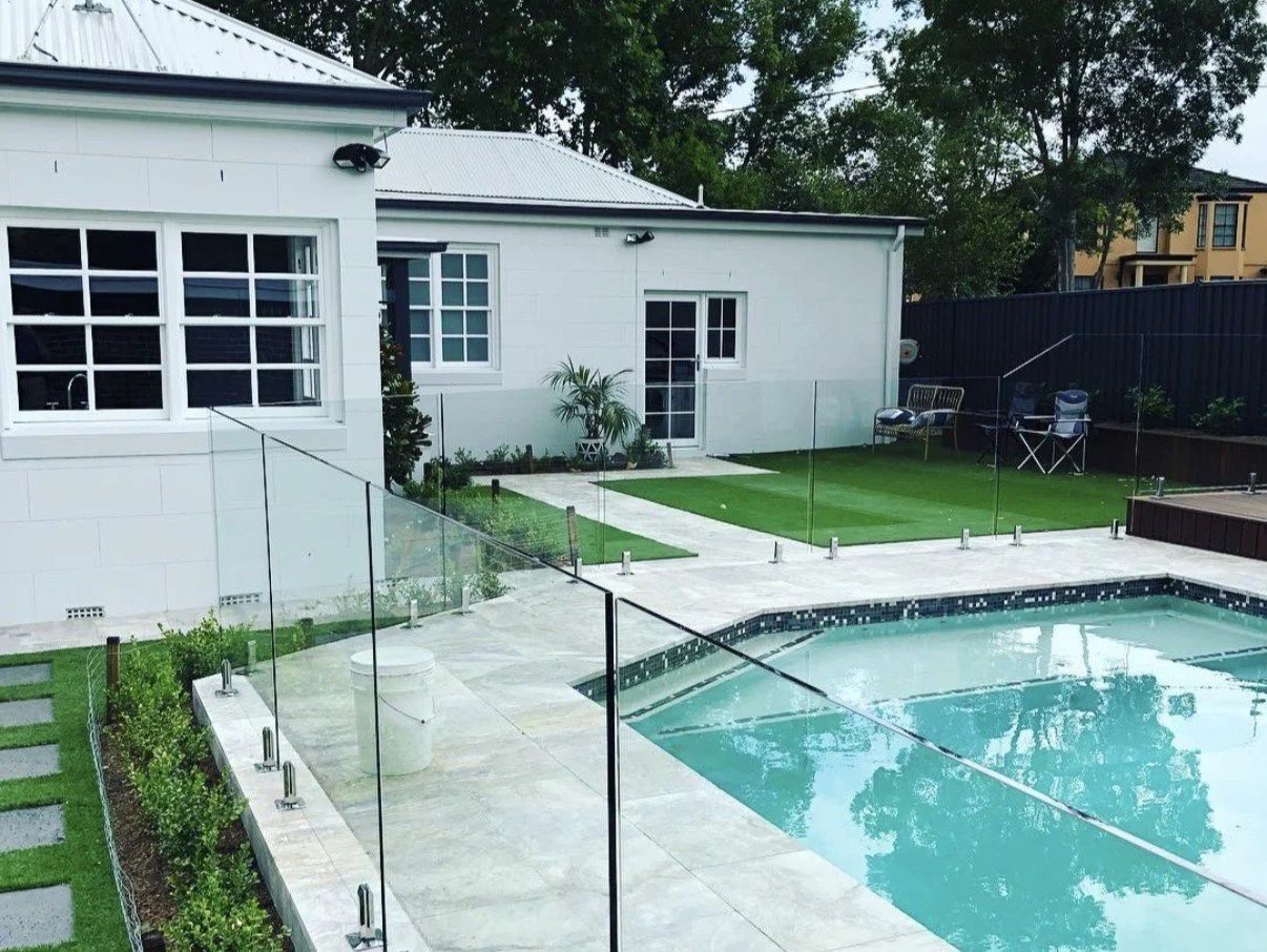 Backyard with swimming pool, glass fence. Exterior window cleaning in Camden and Campbelltown. Colonial Style Windows and doors. Entertaining area.
