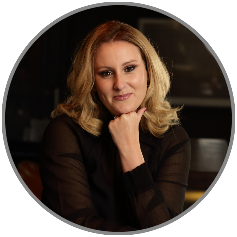 Anne-Marie Lacey, CIPR President-Elect 2027 candidate, seated at a table with her chin resting on her hand, looking at the camera.
