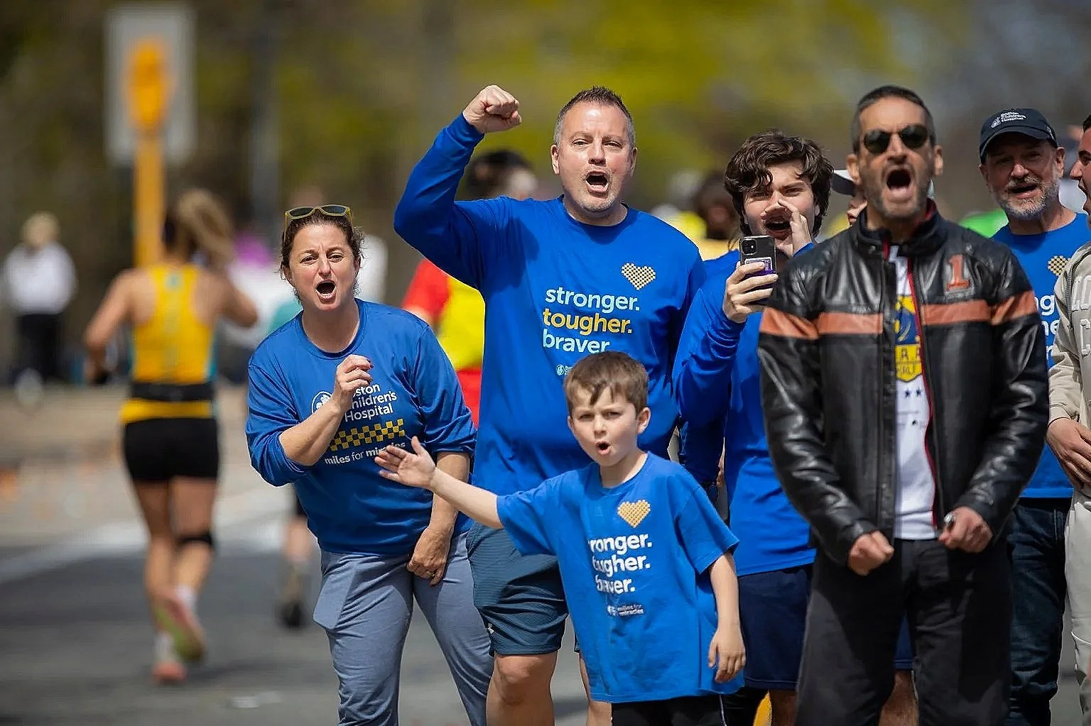 Boston Children’s Hospital teammates cheering as Bob approached mile 13 of the Boston Marathon.