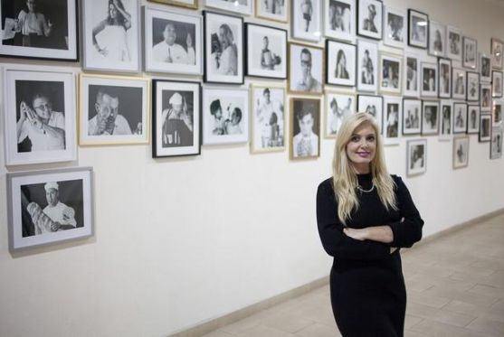 Marisa Ruiz beside her photographic exhibition in Fuerteventura, 2018.