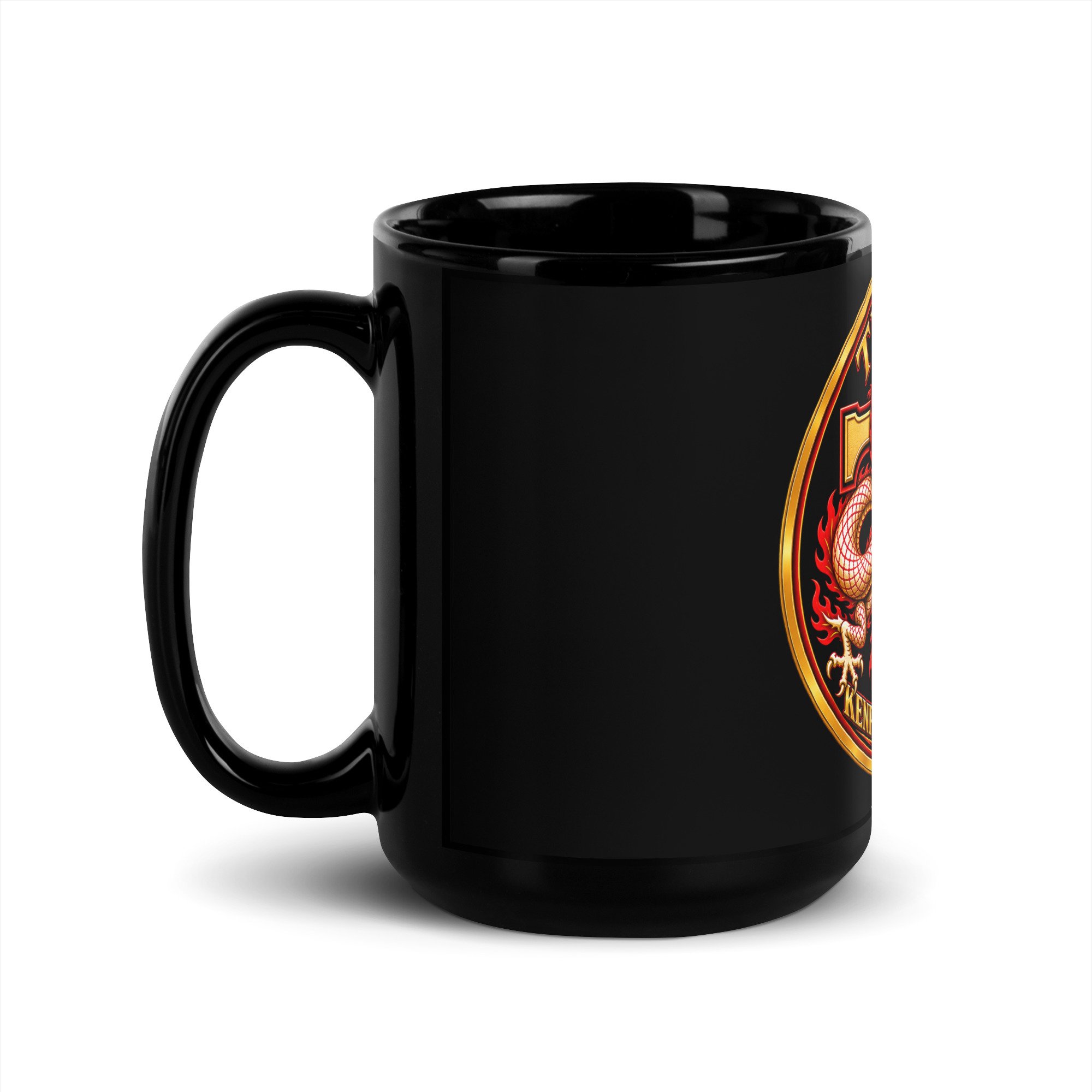 15 oz Tracy’s Kenpo Legacy black mug with the handle on the left and the dragon logo partly visible.