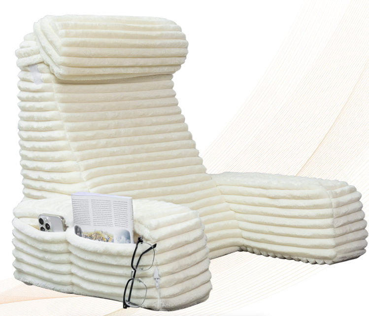 White padded reading pillow with headrest, arm supports and storage pockets conveying cozy comfort.