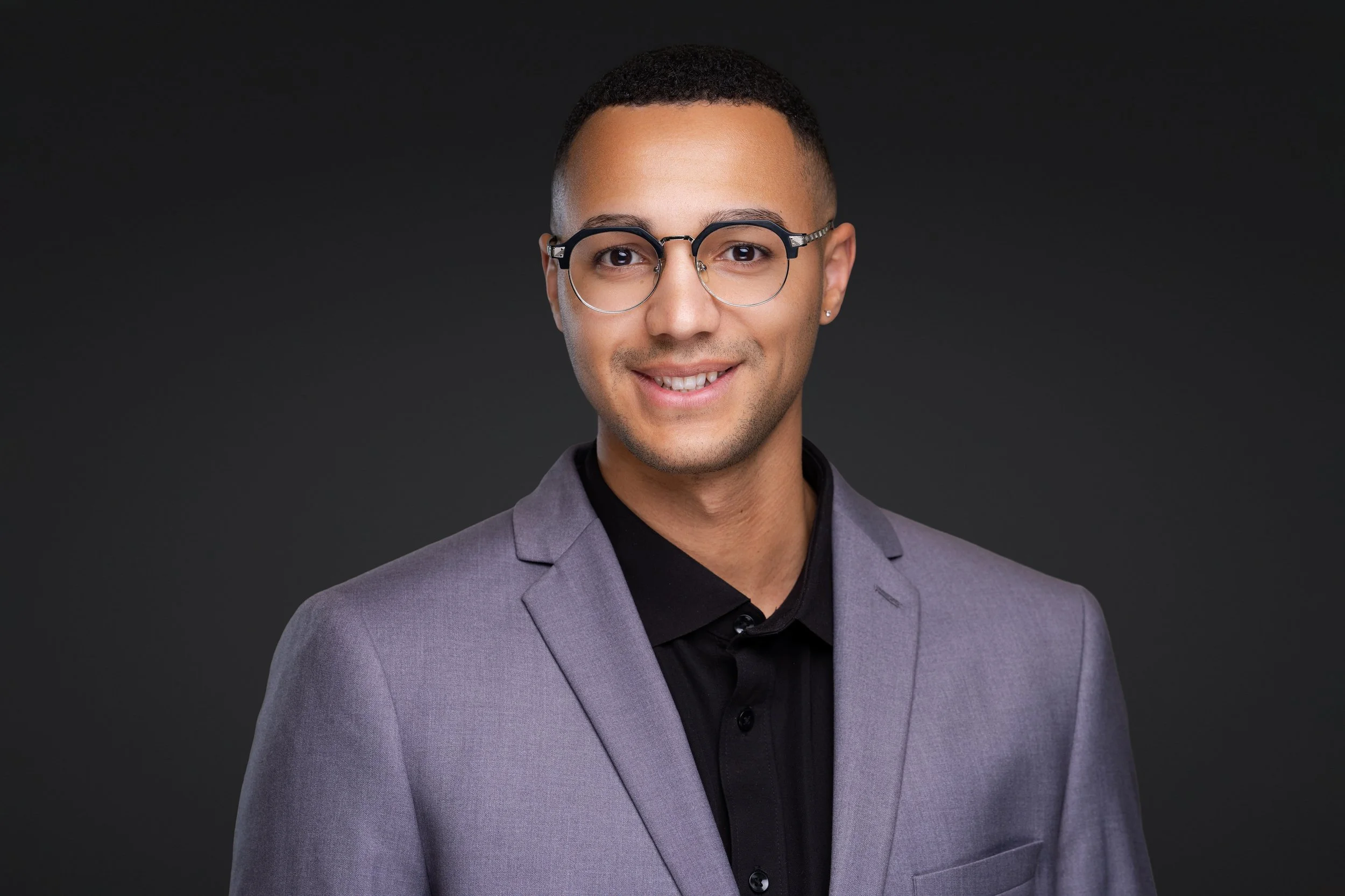 A portrait headshot of a tech man.