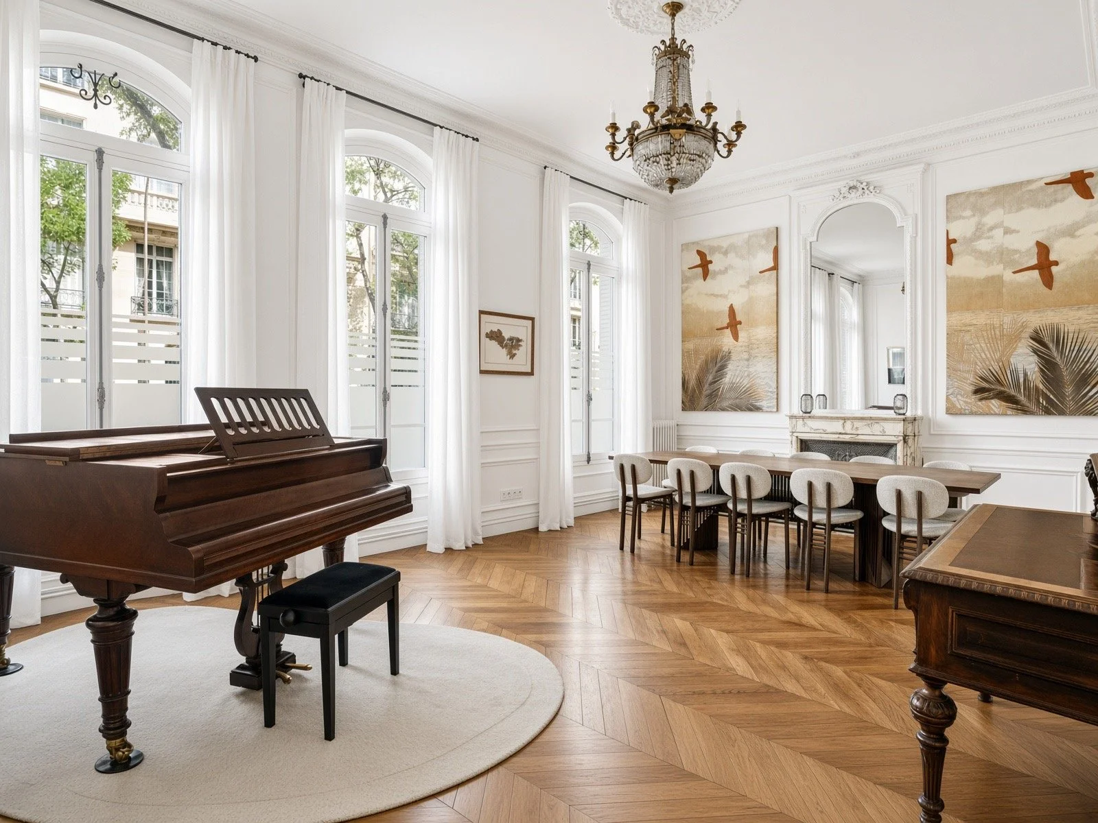 Elegant dining room with a grand piano, a long wooden table, and white upholstered chairs, large windows with white curtains, and artwork on the walls.