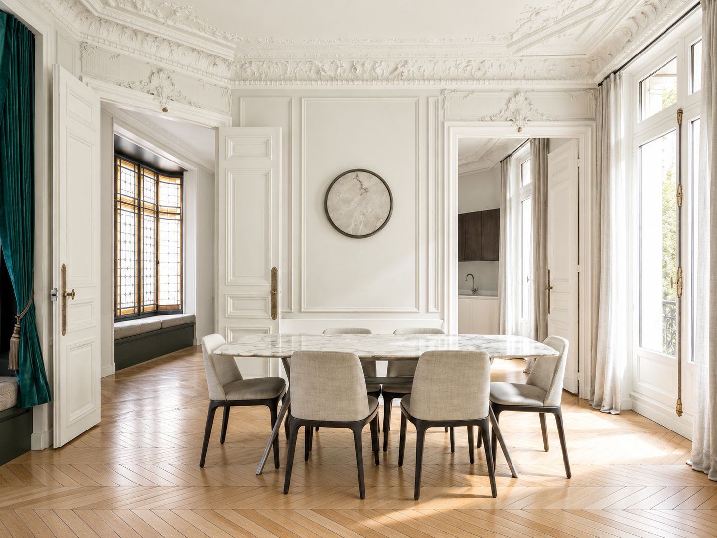Elegant dining room with white walls, windows with curtains, a marble dining table, six beige chairs, and a decorative wall clock.