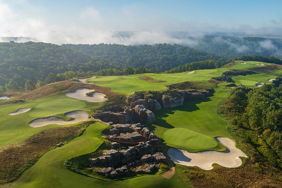 Rolling golf fairways, greens, and rock formations at Mountain Top, Big Cedar Lodge.