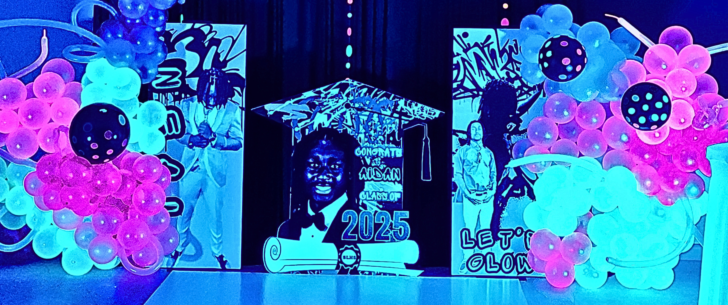 An elevated Let’s Glow graduation celebration designed with radiant neon lighting, vivid color pops, and a dynamic, immersive vibe.