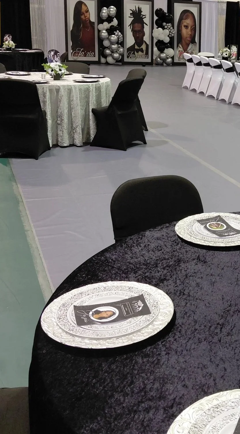 A sophisticated black, white, and silver graduation celebration for three, featuring bold custom photo boards that anchor the entire design.