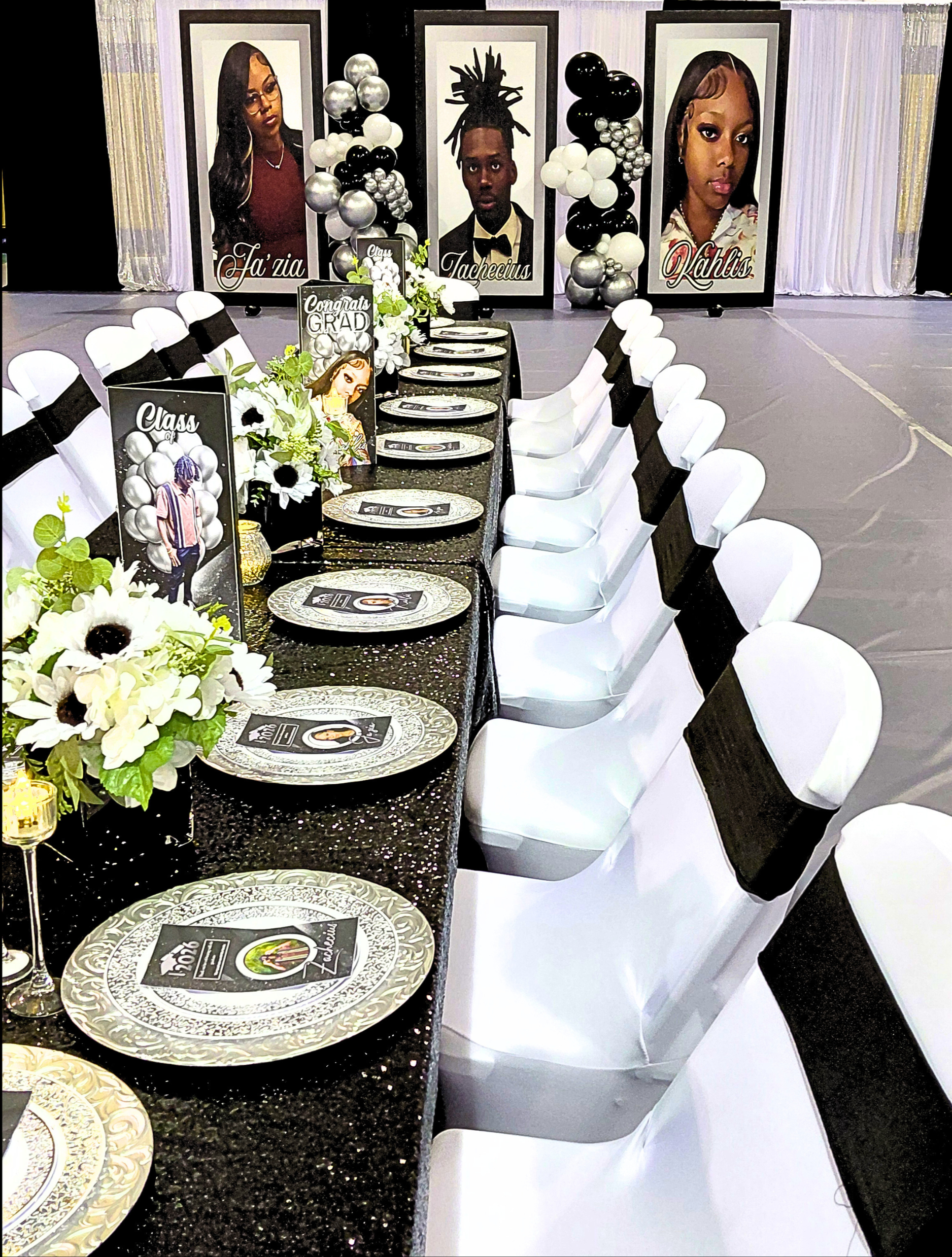 A sophisticated black, white, and silver graduation celebration for three, featuring bold custom photo boards that anchor the entire design.