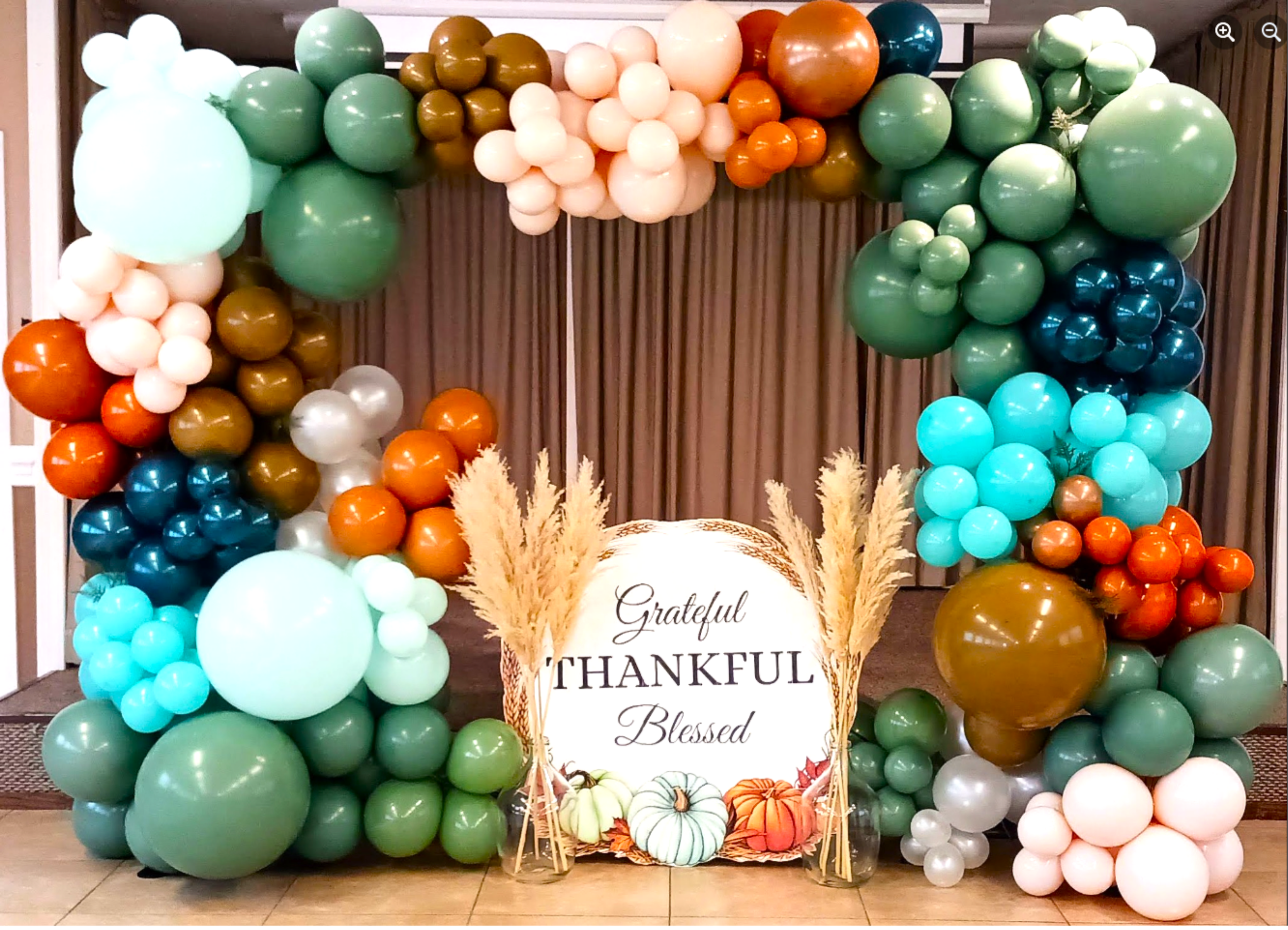 A family style Thanksgiving dinner featuring rich fall tones and a festive backdrop that enhances the celebration.