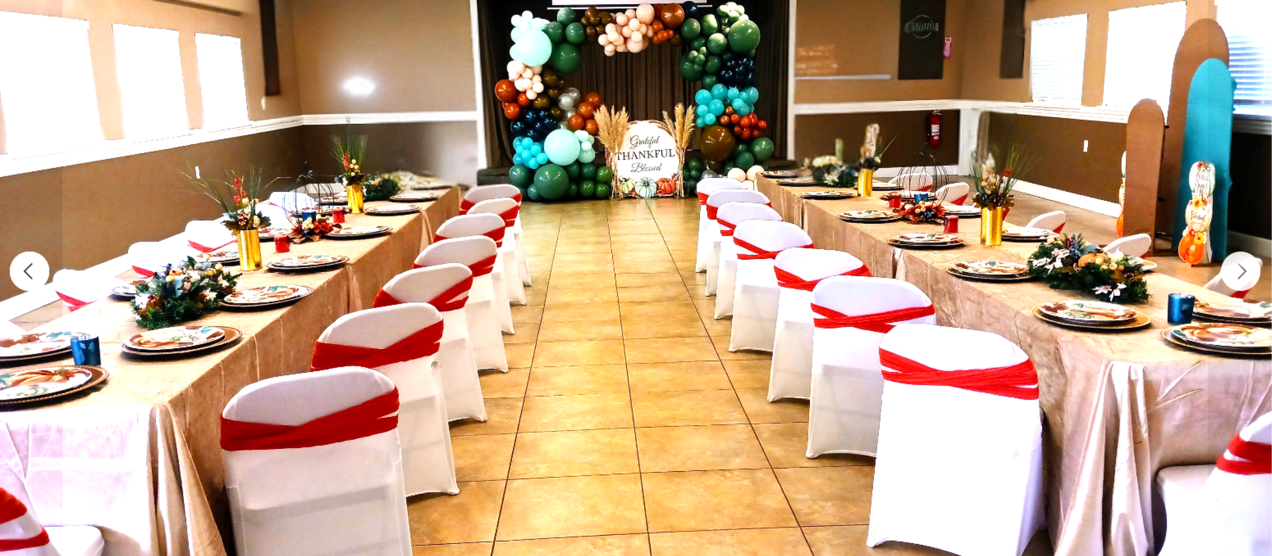 A family style Thanksgiving dinner featuring rich fall tones and a festive backdrop that enhances the celebration.