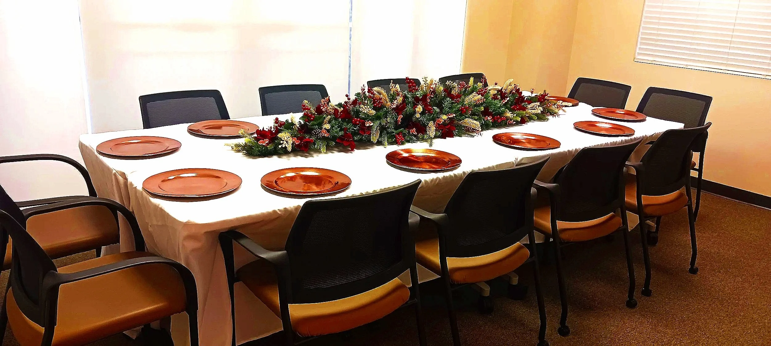 A cheerful office Christmas party brought to life with timeless red and green tones, highlighted by hints of gold and rose gold.