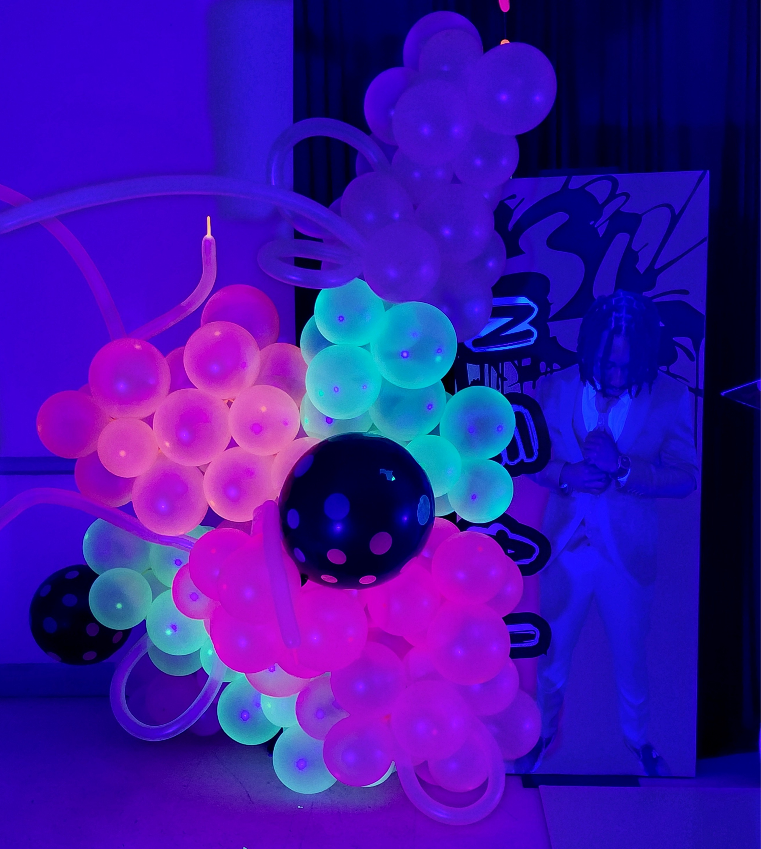 An elevated Let’s Glow graduation celebration designed with radiant neon lighting, vivid color pops, and a dynamic, immersive vibe.