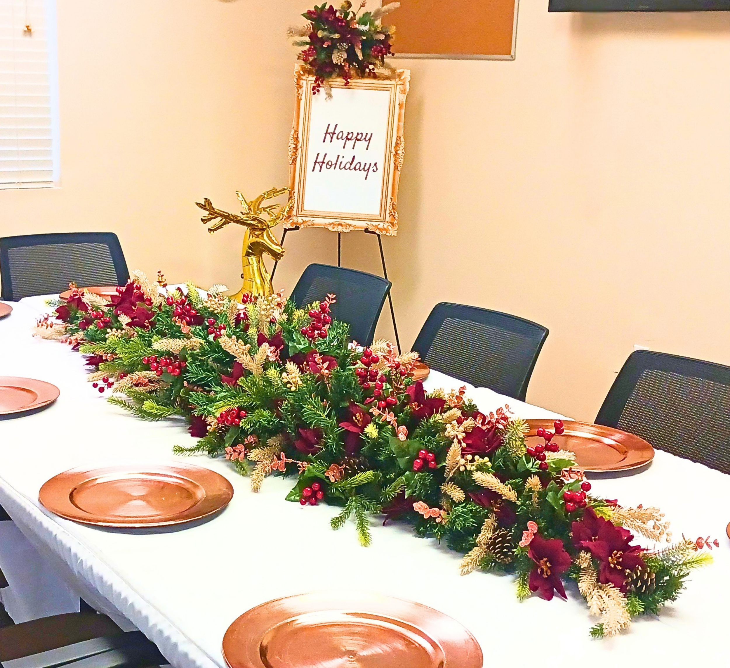 A cheerful office Christmas party brought to life with timeless red and green tones, highlighted by hints of gold and rose gold.