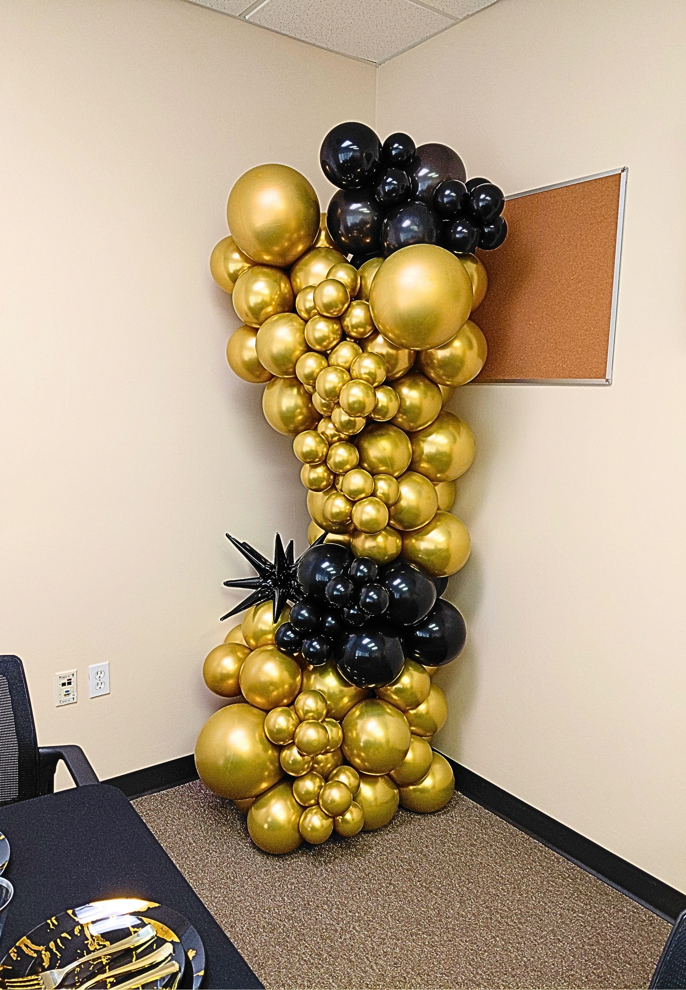 A simple National Bosses Day display featuring black and gold accents for a sleek, professional touch.