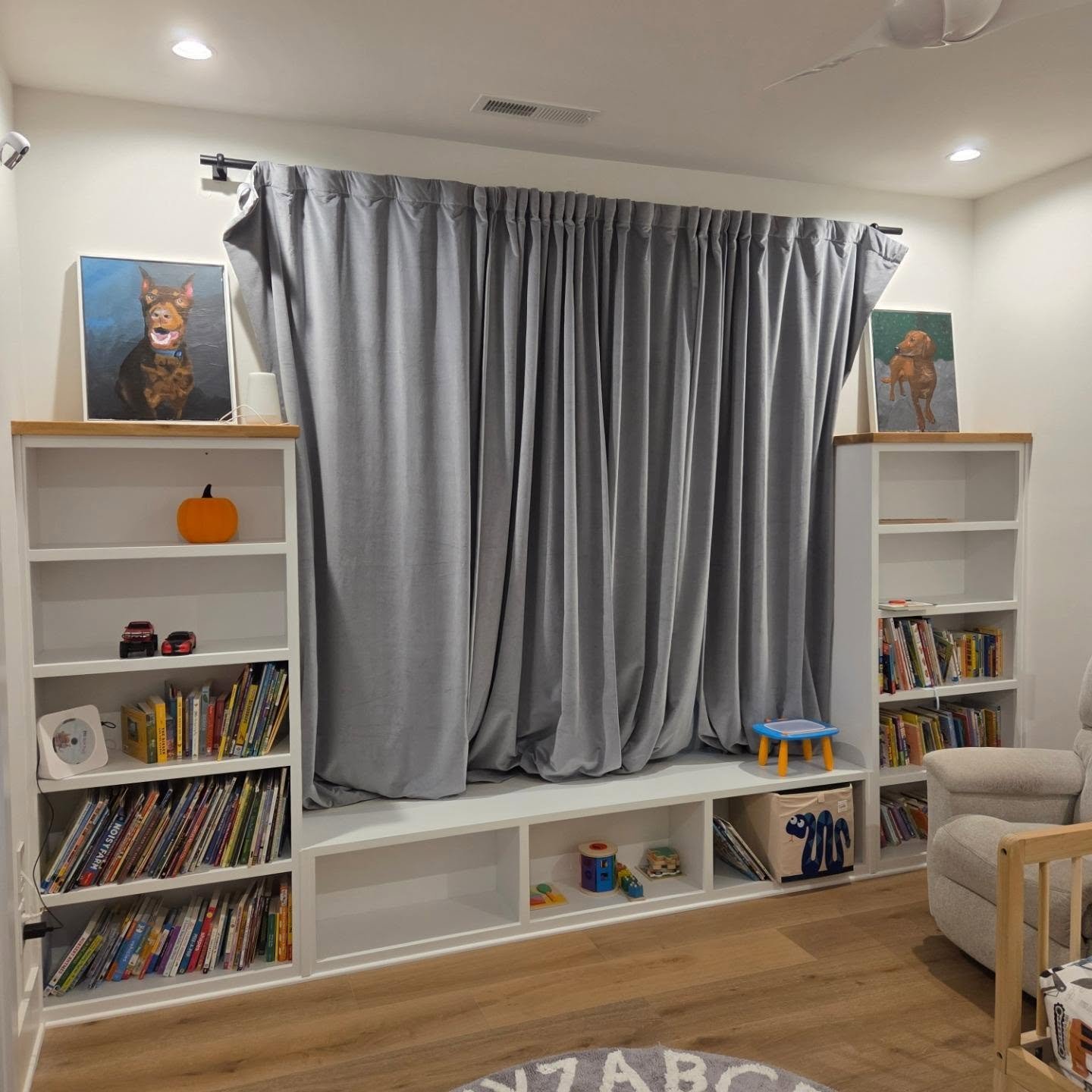 Bedroom Bookcase - A modest unit for book, toy, and miscellaneous storage. White Oak tops. Color: BM OC White. Bench cushion to be added by client.