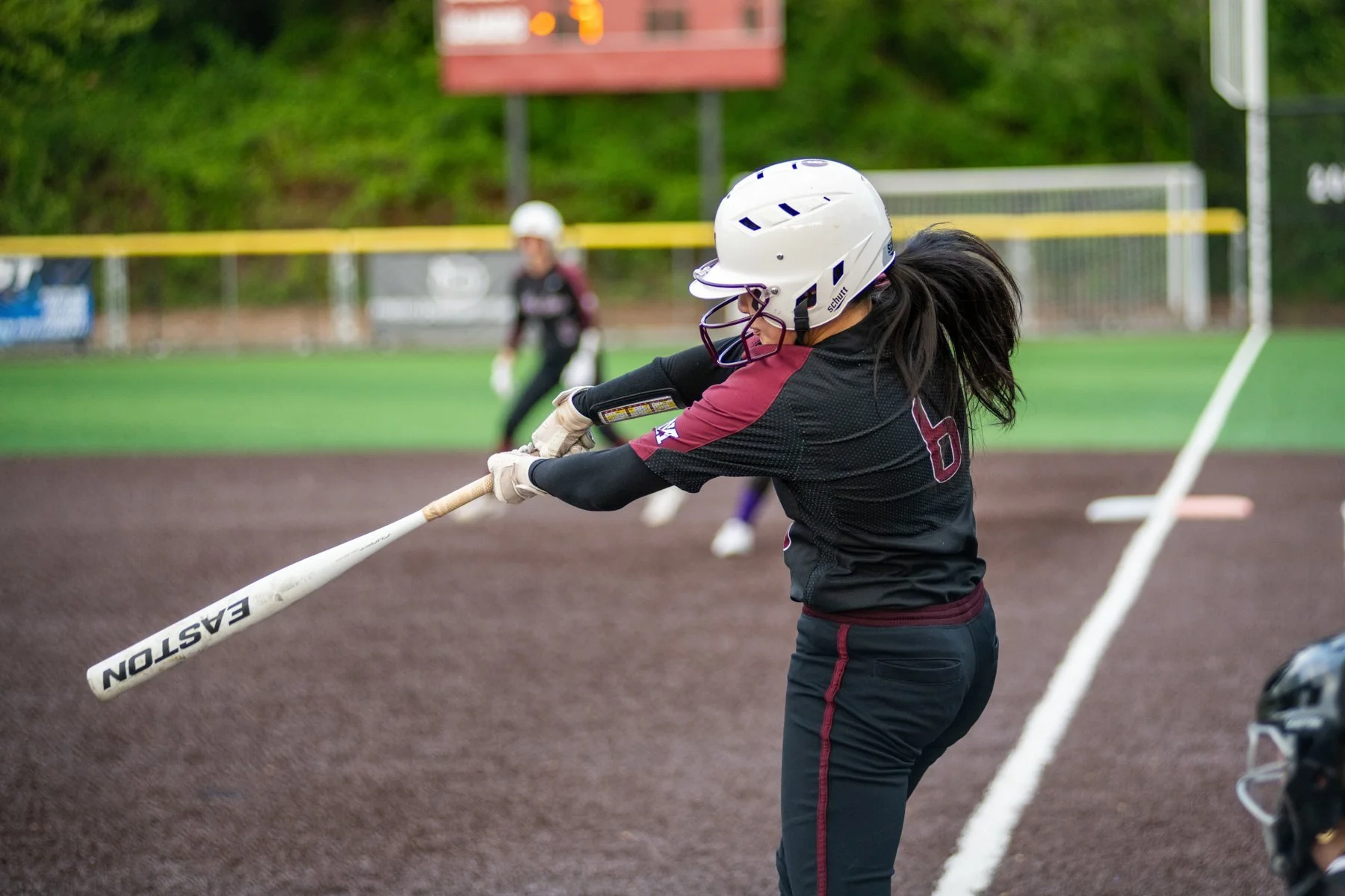 Mercer Island softball batter follows through on a swing.