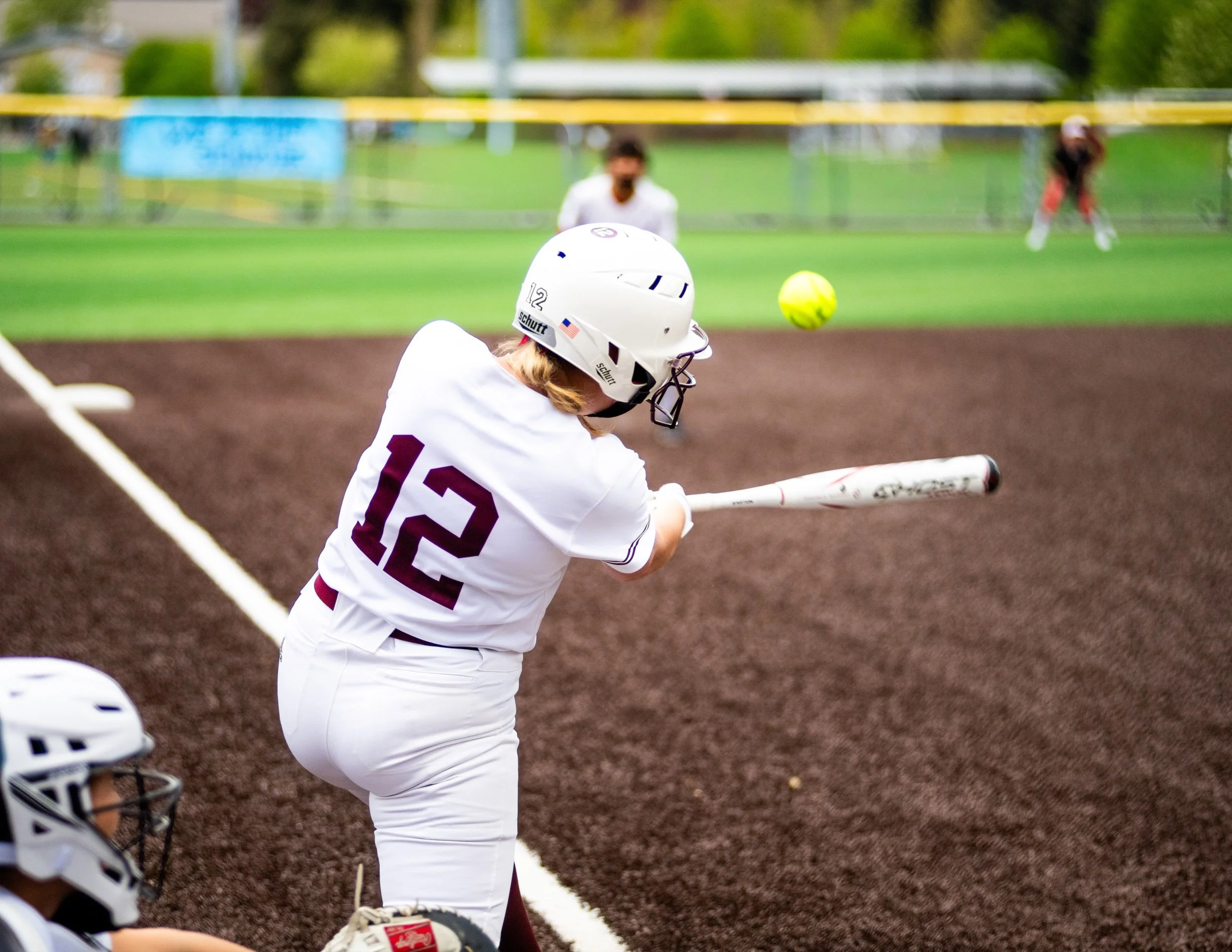 Mercer Island softball batter swings at a pitch.